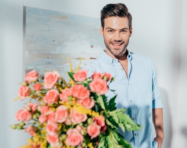 Man giving flowers.